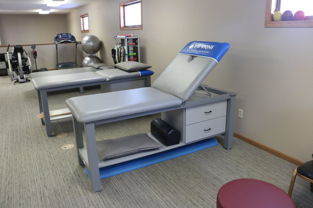 Aluma Elite Basic Treatment Tables with branding