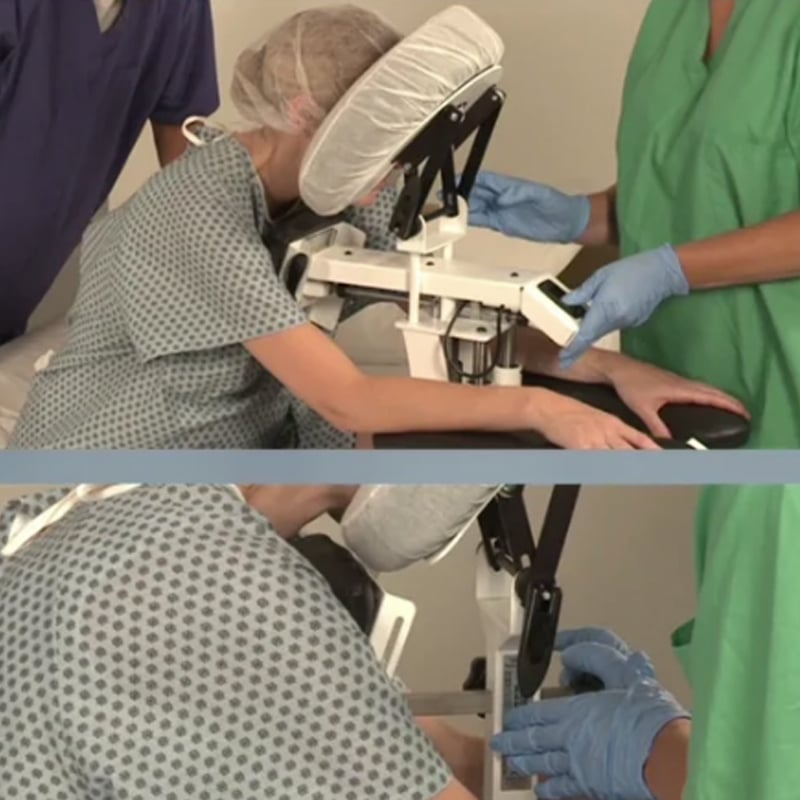 Patient leaning against EPD for epidural procedure